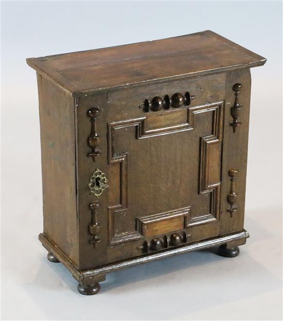 A Charles II oak spice cupboard, W. 1ft 5in. D. 9.5in. H. 1ft 7in.